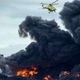 A helicopter tries to extinguish the flames at Sesena.